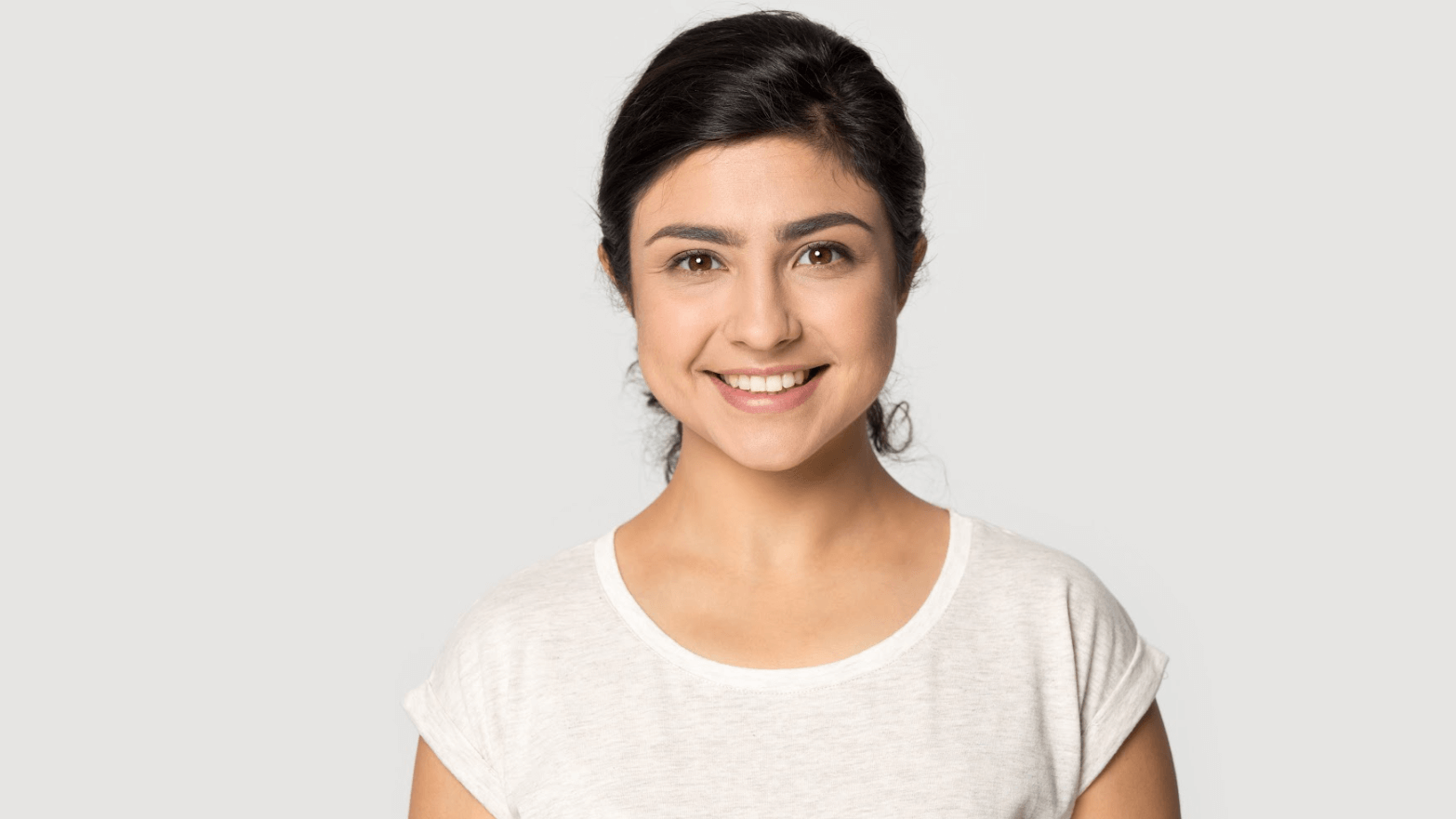 woman in white shirt smiling